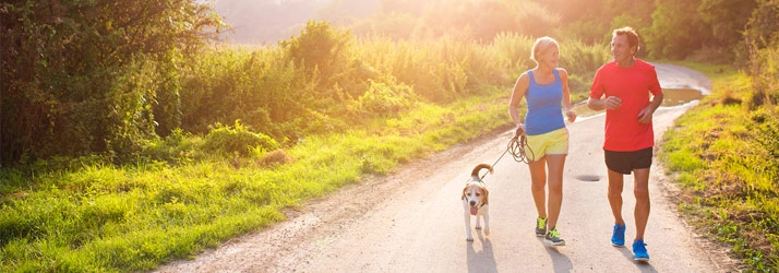 Chiropractic Campbell CA Couple Walking Dog